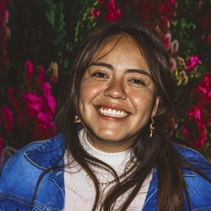 Alex Rivera, Lead Design Curator at Silent Brook Vista, reviewing corporate floral arrangements